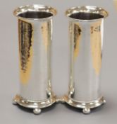 A pair of George V Arts & Crafts silver cylindrical posy vases by Albert Edward Jones, Birmingham,