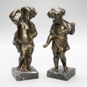 A pair of Victorian bronze putti emblematic of Summer and Autumn, on marble bases 22cm