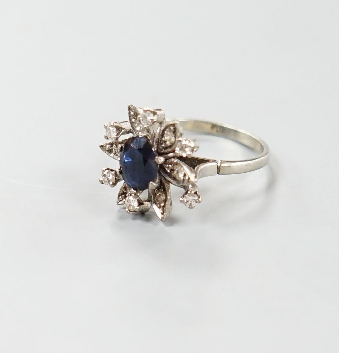 A 1930's 18ct white gold, sapphire and diamond cluster set flower head ring, size Q/R,gross weight 6 - Image 2 of 3