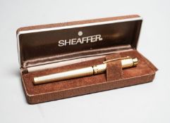 A cased gold plated Shaeffer fountain pen.