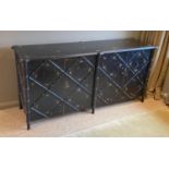 A black painted simulated bamboo low cabinet, with folding doors and floral painted decoration,