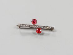 A yellow metal, rose cut diamond chip and two stone red paste set bar brooch, 36mm, gross weight 3.7
