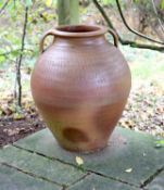 A two handled terracotta garden urn, height 73cm