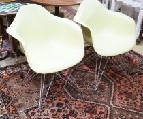 A set of four Eames Vitra aluminium and polycarbonate chairs, width 62cm, depth 48cm, height 80cm