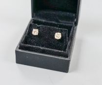 A pair of 750 white metal and solitaire diamond ear studs, gross weight 2.3 grams,stone diameters