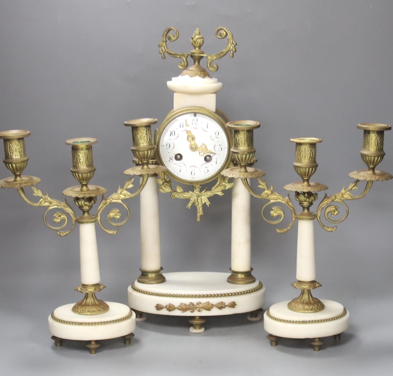 A French ormolu and alabaster clock garniture. Pendulum, no key. 40cm