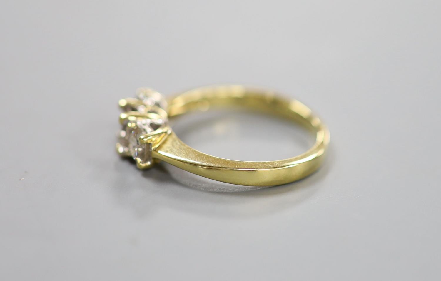 A modern 18ct gold and three stone diamond ring, size M, gross weight 3.4 grams. - Image 2 of 3