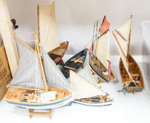 A group of six painted wood boat models