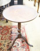 A George III mahogany tilt top tripod table, diameter 53cm, height 71cm (a.f.)