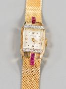 A lady's 18ct gold, ruby and diamond set Gubelin manual wind cocktail watch,on an 18ct gold