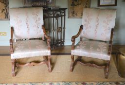 A pair of French carved walnut fauteuils, with machine embroidered eau de nil silk upholstery, width