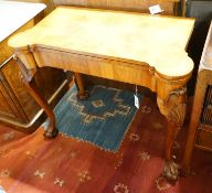 A Queen Anne revival burr walnut card table, with a red leather interior, length 86cm, depth 43cm,