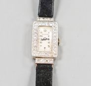A lady's 950 white meta l(platinum?) and diamond set Movado manual wind wrist watch, on a later