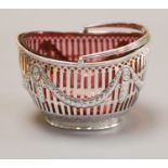A late Victorian pierced silver oval sugar basket, with cranberry glass liner, Nathan & Hayes,