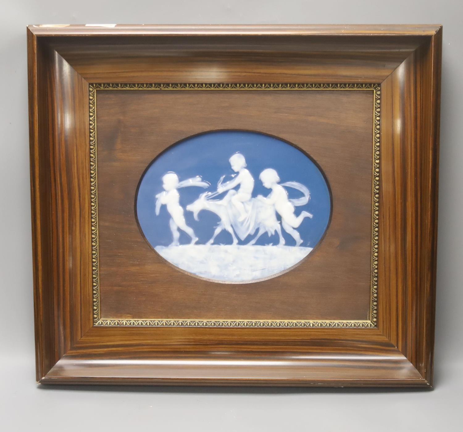 An early 20th century Limoges pate sur pate oval plaque, 18.5x 23.5cm, framedFrame external -