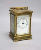 An Edwardian Corinthian brass repeating carriage clock, 20cm high to handle