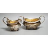 A late George III silver sugar bowl and cream jug, Robert Smeaton, Edinburgh, 1819, gross 19oz.