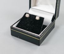 A pair of 750 white metal and solitaire diamond ear studs, gross weight 1.8 grams,stone diameter