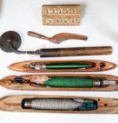 Three weaving shuttles, a crimper and two other items