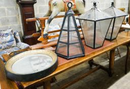 A pair of Victorian style black metal square lanterns, height 68cm together with one other and a