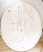 A cast plaster oval figural plaque