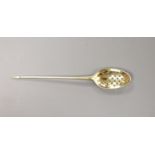 A mid 18th century silver gilt mote spoon, 13.6cm, indistinct marks.