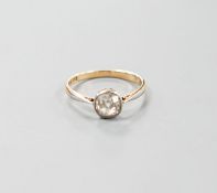 A yellow metal and collet set solitaire diamond ring, size O/P, gross weight 2.3 grams,the stone