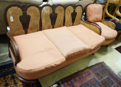 A 1920's caned beech two piece bergere suite, sofa length 167cm, depth 178cm, height 80cm