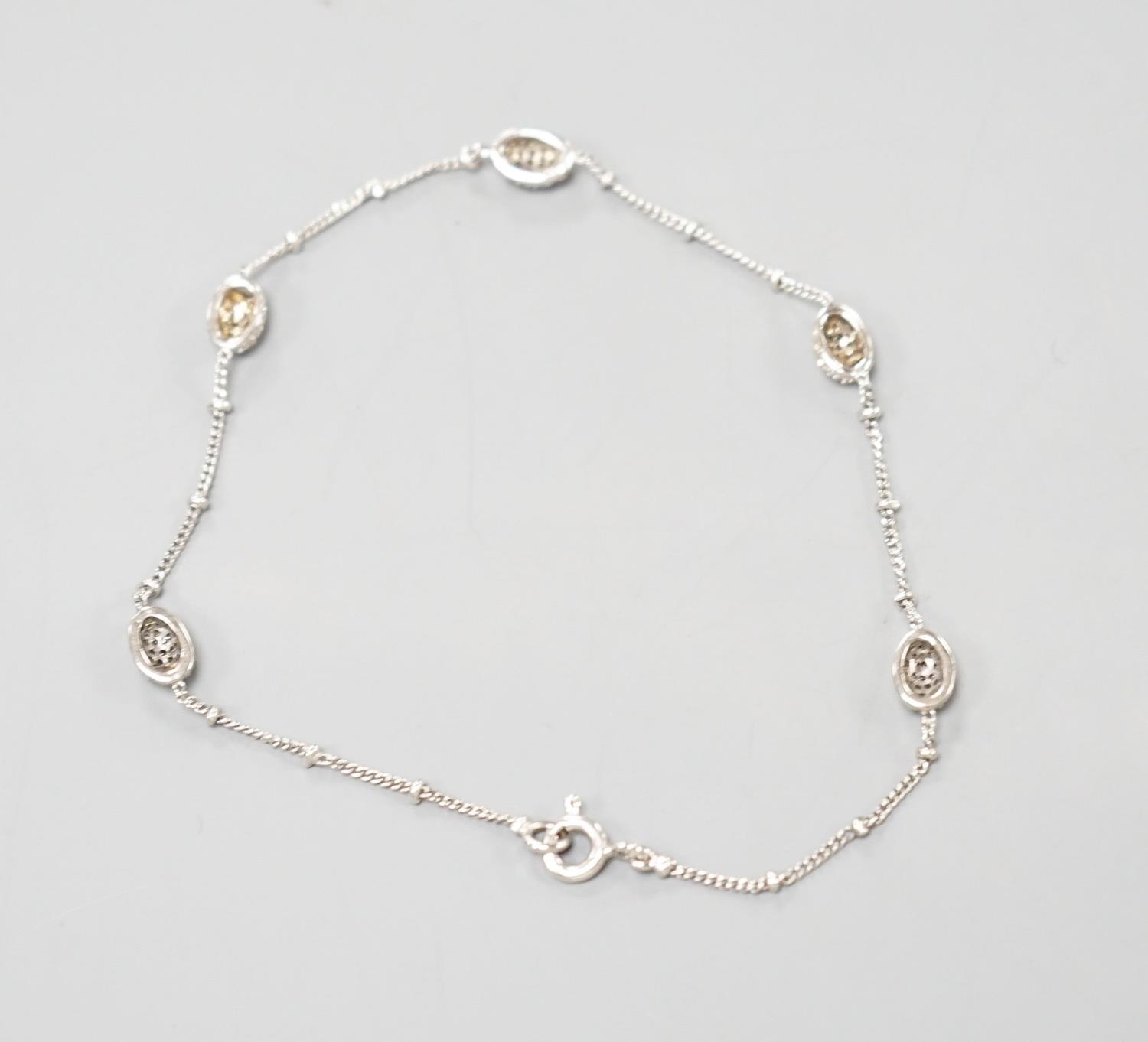 A modern 750 white metal and diamond chip set demi lune link bracelet, 19cm,gross weight 3.1 grams. - Image 4 of 4