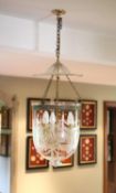 A cut and etched glass hurricane style ceiling light, height 54cm diameter 30cm, fitted for