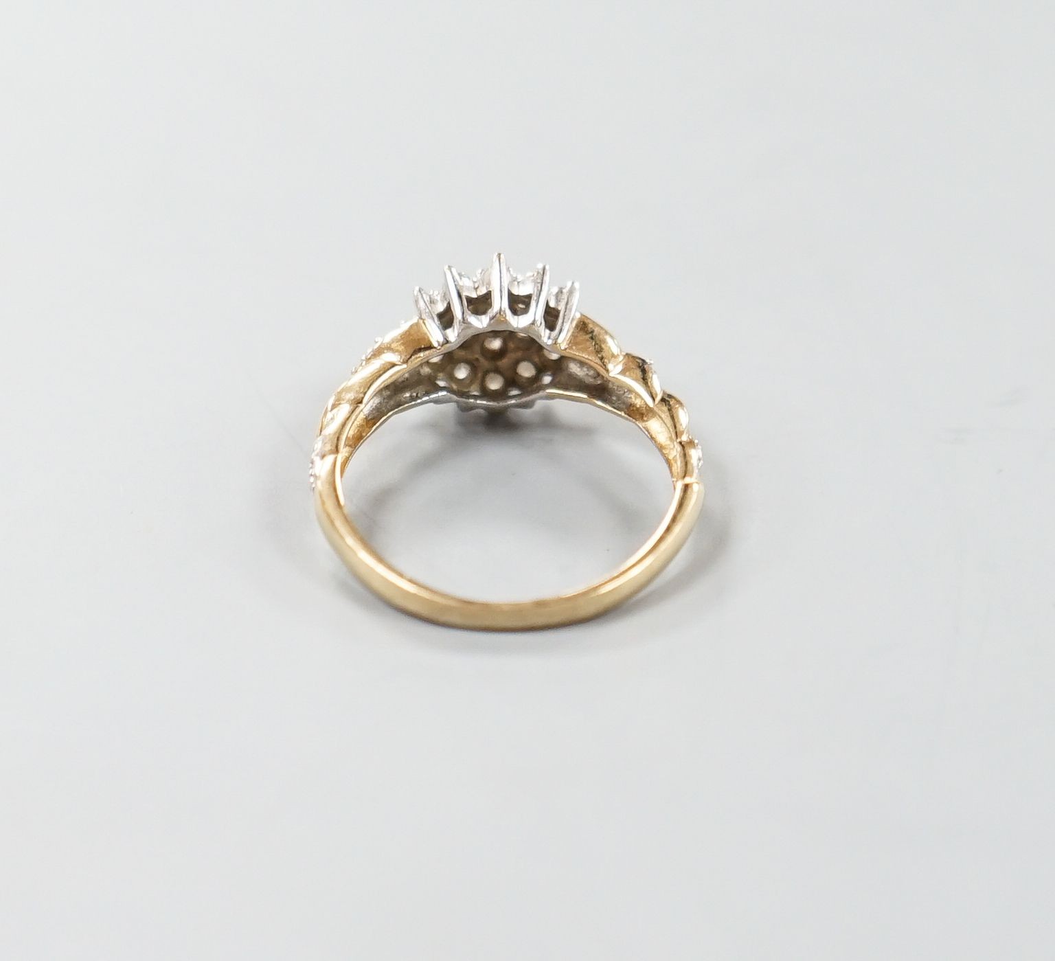 A modern 9ct gold and diamond cluster ring, with diamond chip set shoulders, size P, gross weight - Image 3 of 3