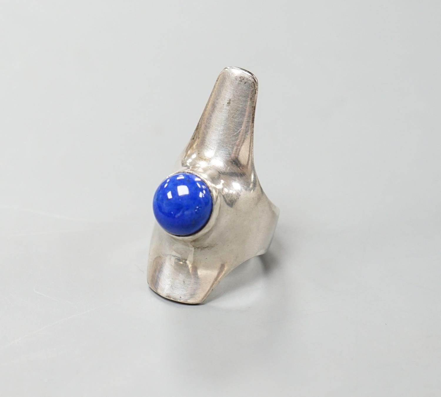 A Georg Jensen sterling and lapis lazuli set upfinger ring, no. 154, size K/L.