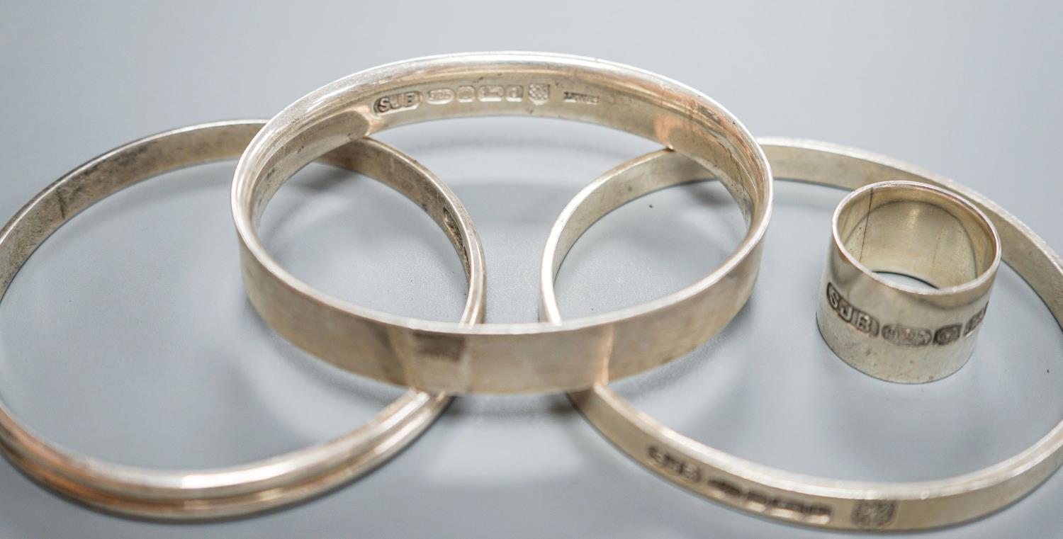 Three modern silver bangles and a large silver band, all by Simon J. Beer of Lewes,191 grams, ring - Image 5 of 5