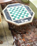 A Regency style brass mounted octagonal rosewood and specimen marble games table, width 49cm, height