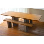 A contemporary oak kitchen table with pair of matching benches and oxidised metal supports, table
