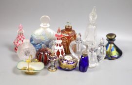 A collection of various glass scent bottles including a Lalique flower scent bottle and Bohemian