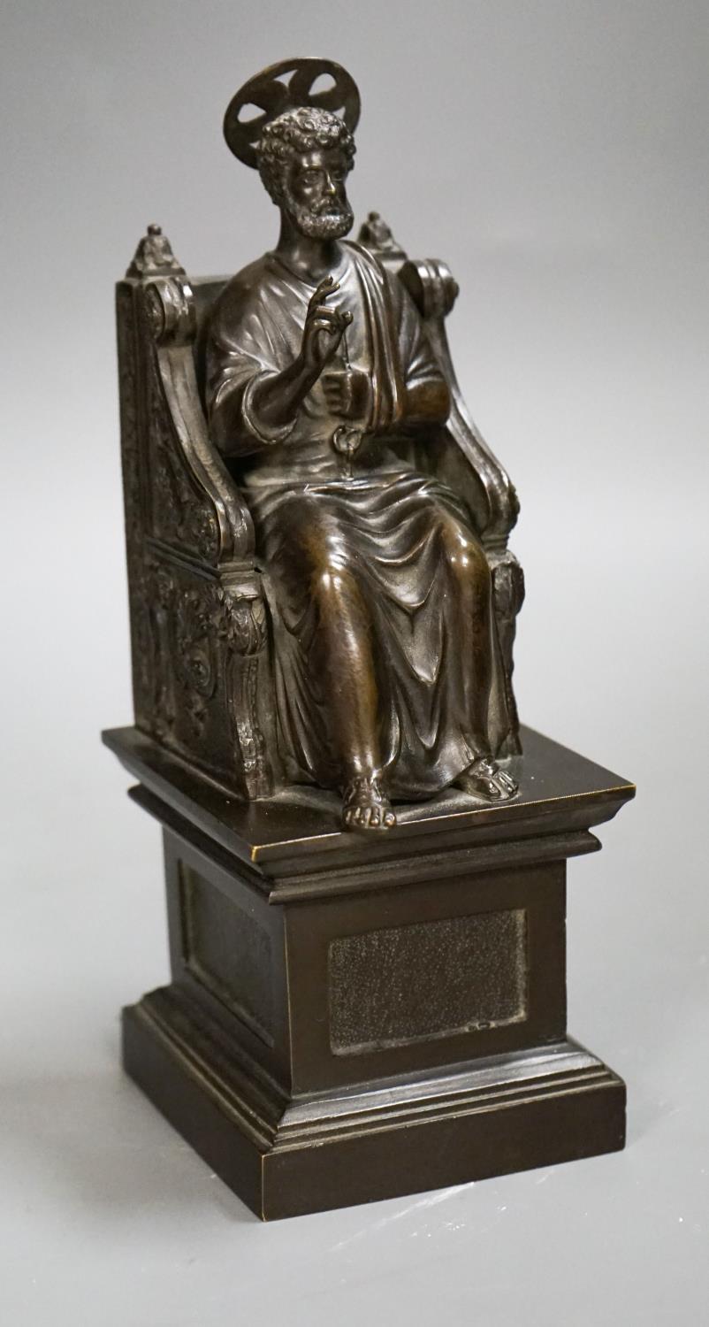 A late 19th century bronze figure of St. Peter seated on a throne, 22cm