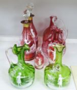 A collection of Mary Gregory cranberry and green glass decanters, jug etc (9), tallest 28.5 cm