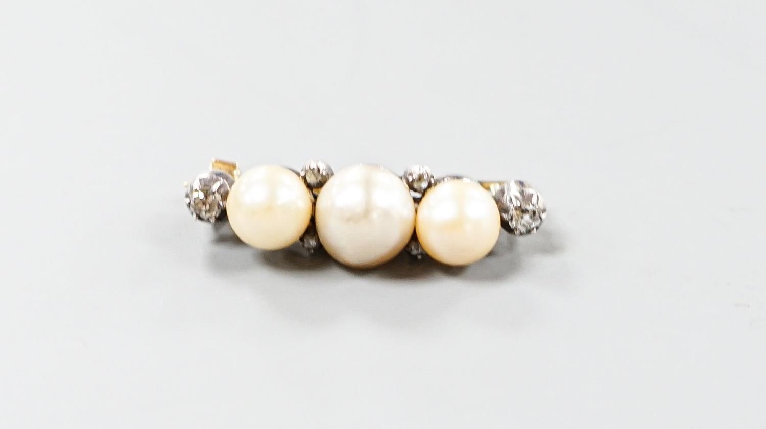 A yellow metal, three stone cultured pearl and six stone diamond brooch, 34mm, gross weight 8.1