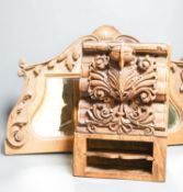 A carved Indian hardwood corbel shaped container, 33 cm, and carved beech mirror frame 59cm