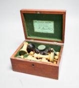 A boxed Jaques Staunton boxwood and ebony chess set, White king stamped Jaques London, 8.5cm high