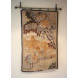 A French tapestry wall hanging, decorated with a town and trees, 125 x 79cm, with associated wrought
