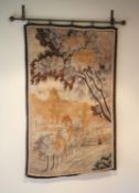 A French tapestry wall hanging, decorated with a town and trees, 125 x 79cm, with associated wrought