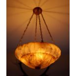 A foliate carved alabaster light bowl, diameter 56cm drop including chains 90cm