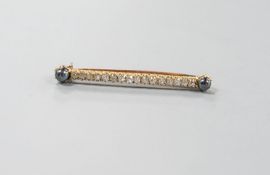 A yellow metal, two stone hematite and sixteen old cut diamond set bar brooch, 52mm, gross weight