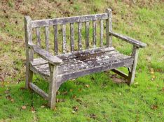 A pair of weathered teak garden benches, width 158cm