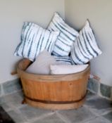 A French coopered pine grape bin, width over handles 97cm, and six assorted cushions