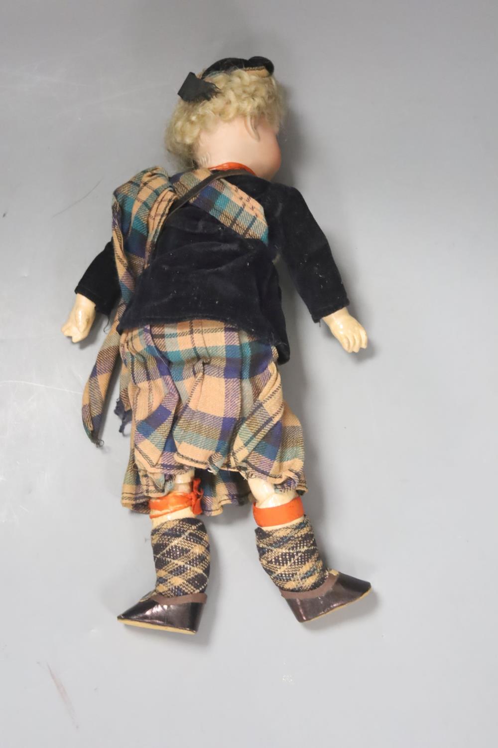 An AM bisque doll, Scottish dress. 30cm - Image 2 of 3