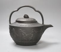 An unusually large Wedgwood black basalt teapot and associated cover, c.1800, 25cm