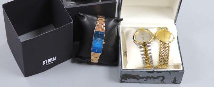 A gentleman's modern steel and gold plated Omega De Ville quartz wrist watch, a Storm watch and a